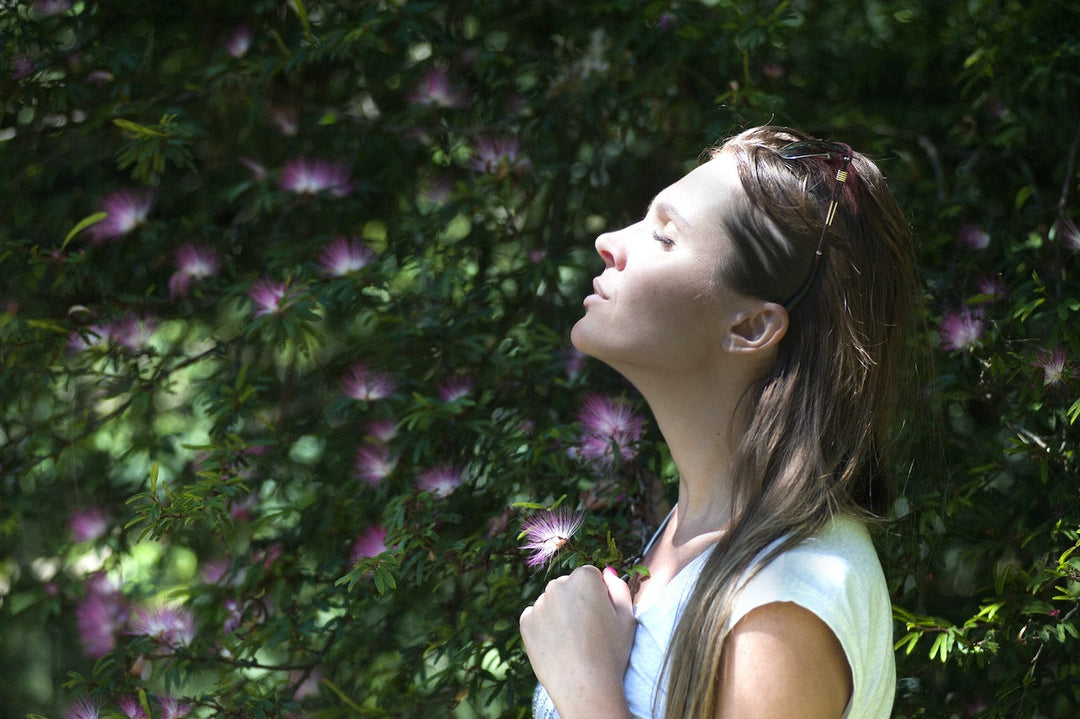 Woman doing breathing exercise outdoor